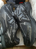 Stylish black sneakers with breathable mesh and synthetic overlays, designed for running comfort and support.