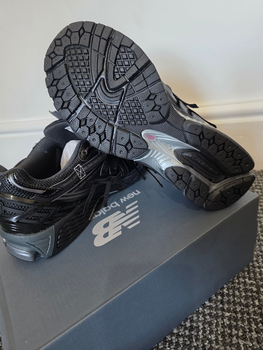Sneakers showing the tread and design, highlighting comfort and style in authentic designer footwear.