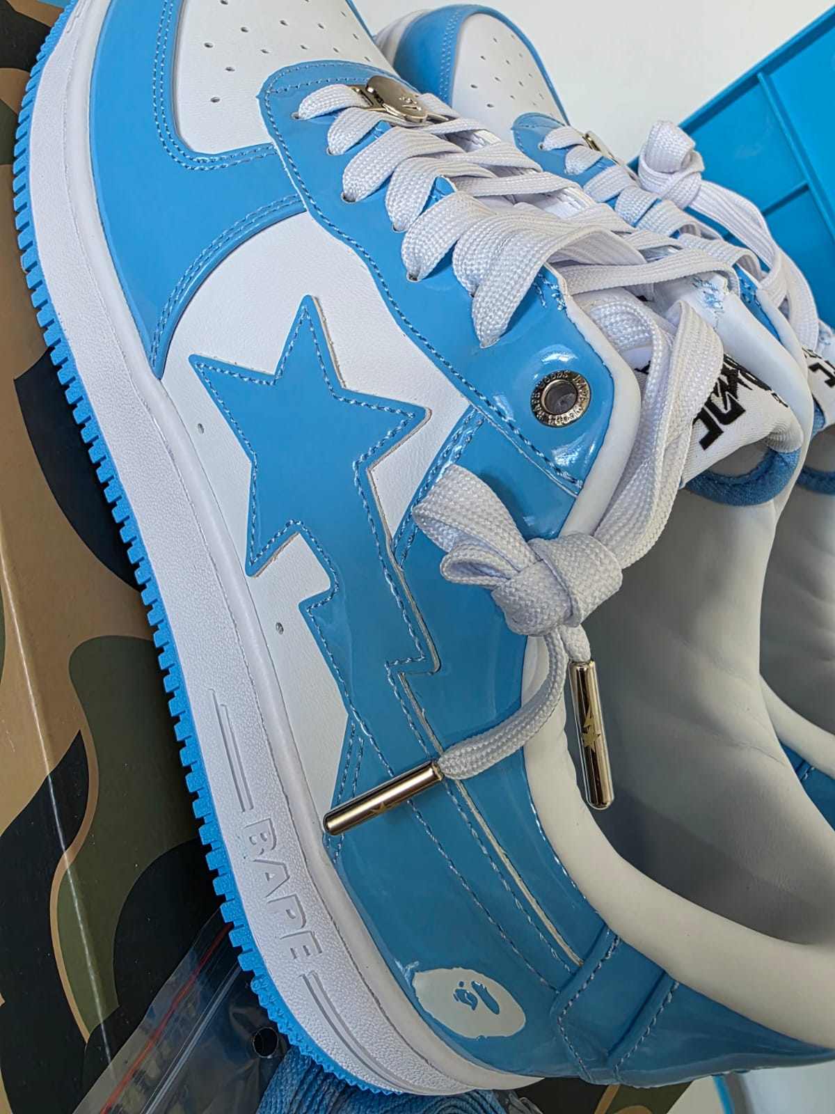 BAPE STA Lows Premium Streetwear Sneakers in blue and white with star design and stylish laces.