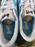 BAPE STA Lows premium streetwear sneakers showcasing a blue colorway and branded insoles.