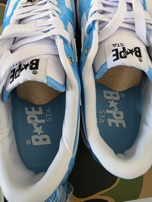 BAPE STA Lows premium streetwear sneakers showcasing a blue colorway and branded insoles.