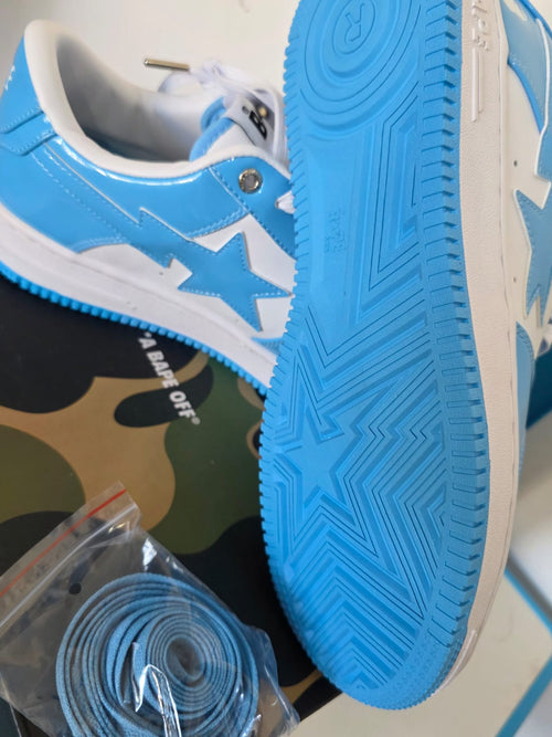 BAPE STA Lows premium streetwear sneakers in blue with textured sole and extra laces.