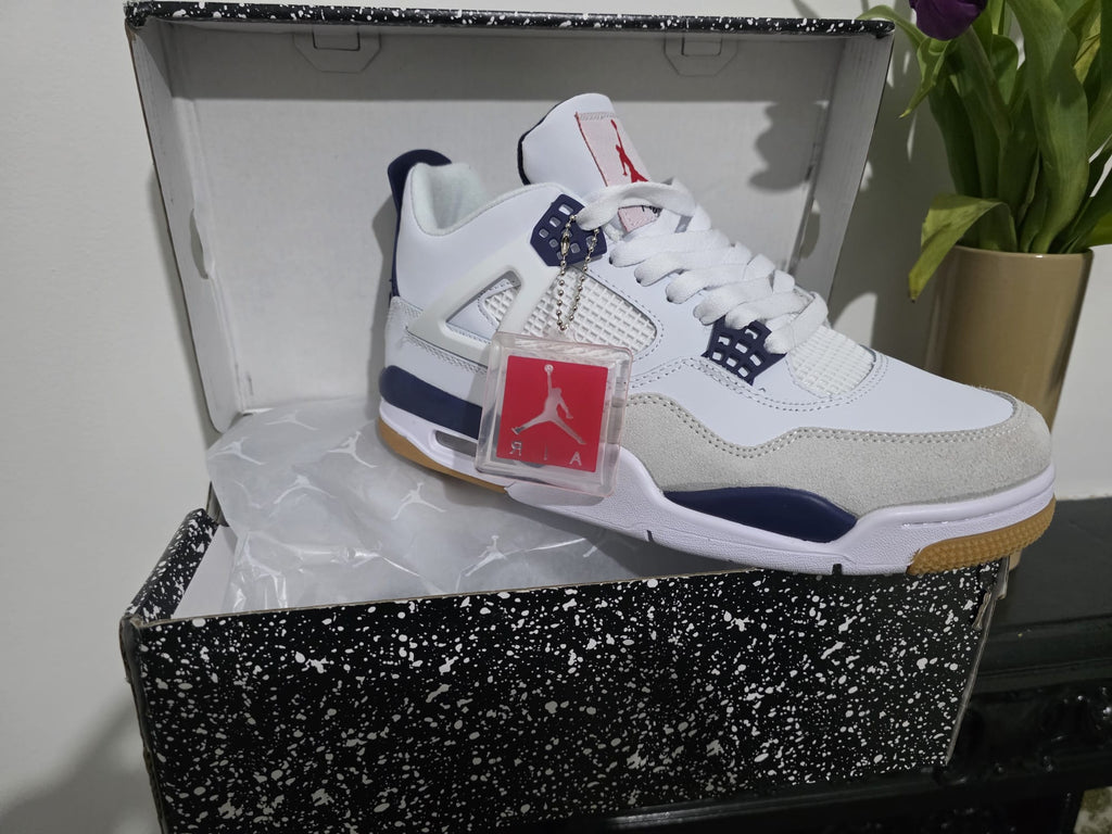 Nike Air Jordan 4 style trainers in a box with tag, showcasing premium design and authentic style.