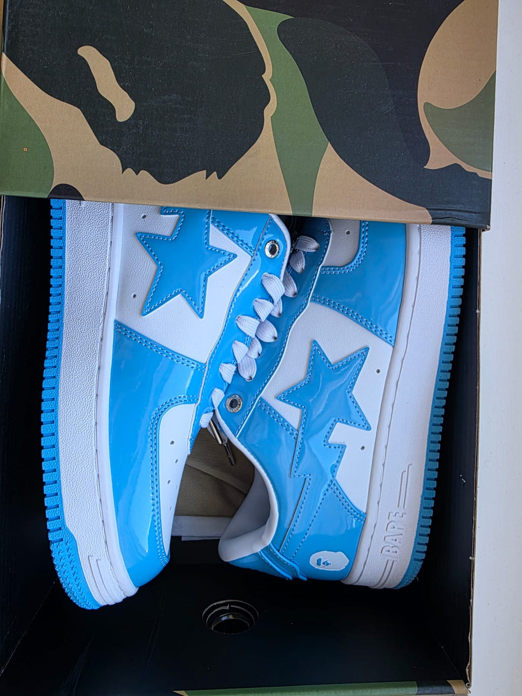 BAPE STA Lows Premium Streetwear Sneakers in blue and white with star design and stylish laces.